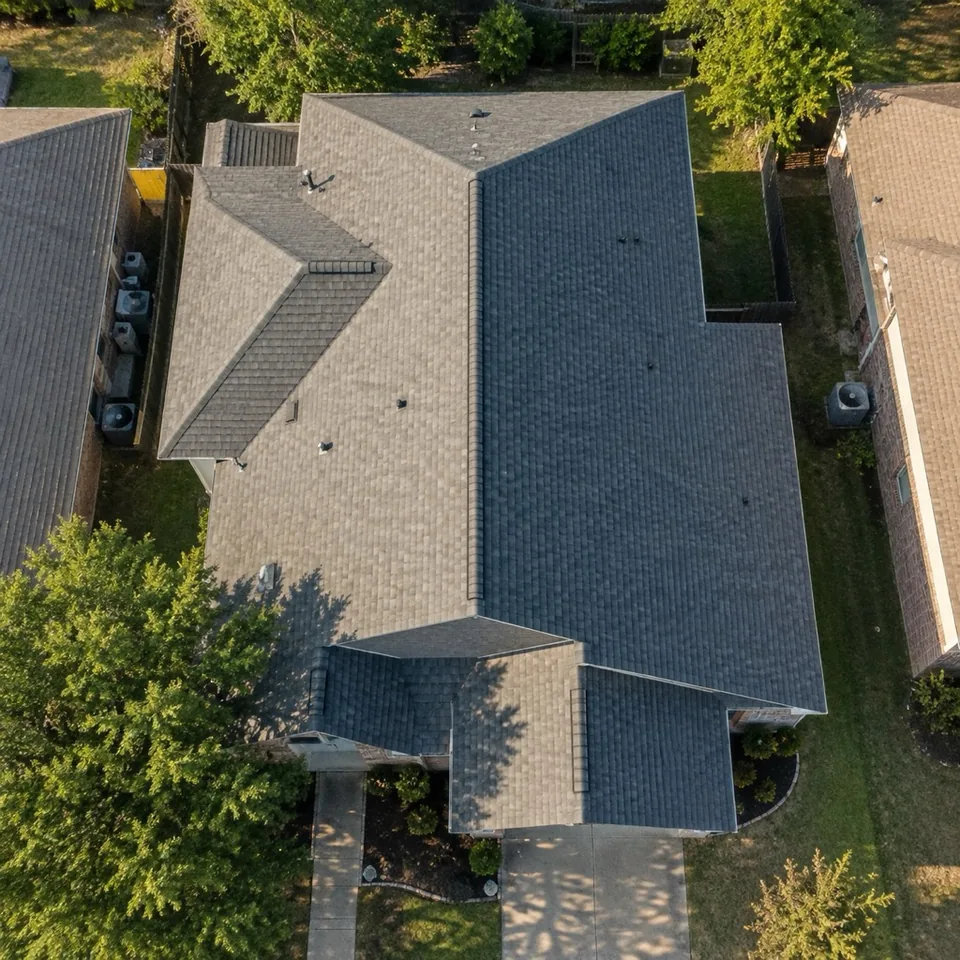 AI-generated illustration of a shingle roof seen from above.